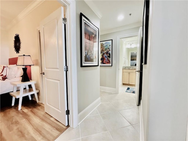 1601 Bienville Blvd Unit 316, Dauphin Island, AL 36528 - corridor featuring light tile patterned floors, baseboards, and ornamental molding