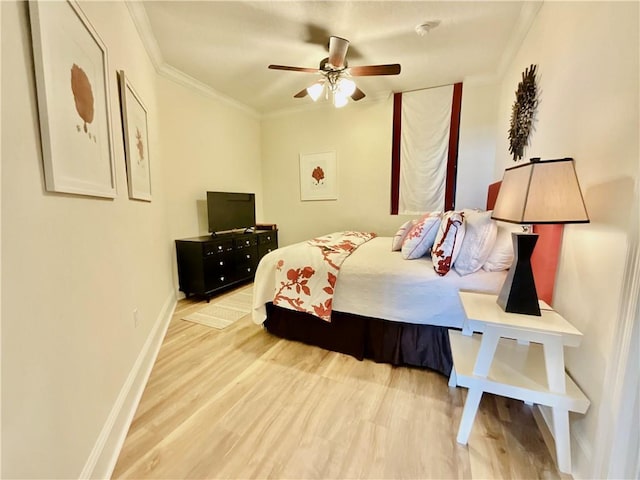 1601 Bienville Blvd Unit 316, Dauphin Island, AL 36528 - bedroom with wood finished floors, ceiling fan, baseboards, and ornamental molding