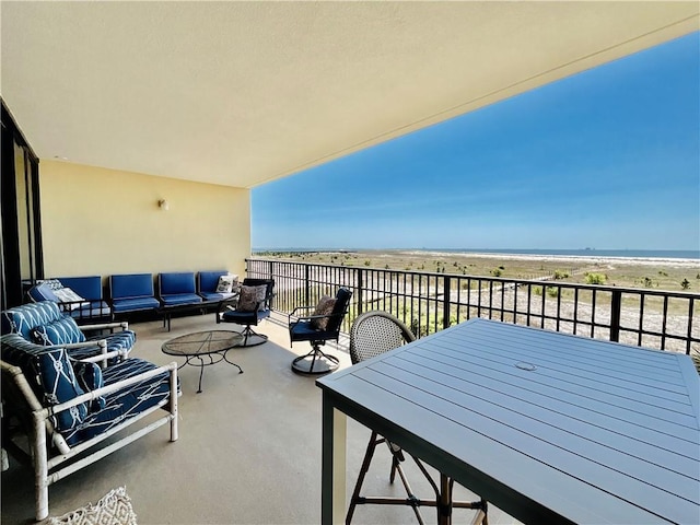 1601 Bienville Blvd Unit 316, Dauphin Island, AL 36528 - balcony featuring a water view, an outdoor living space, and a beach view