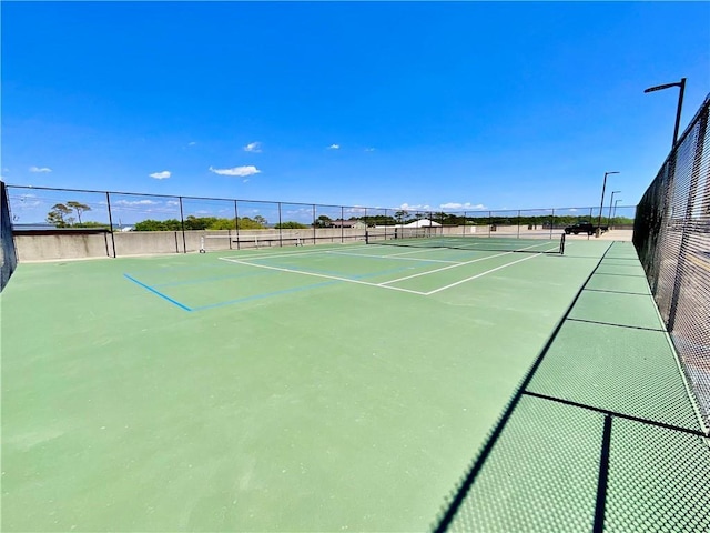 1601 Bienville Blvd Unit 316, Dauphin Island, AL 36528 - view of tennis court with fence