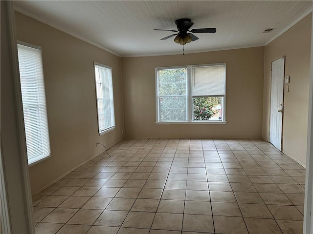 tiled empty room featuring ceiling fan, plenty of natural light, and crown molding