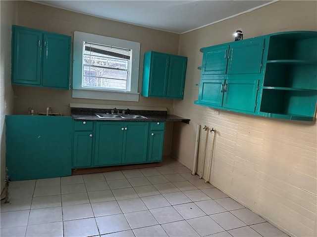 kitchen with sink and light tile patterned floors