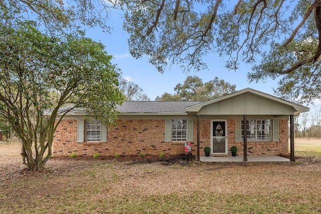 single story home with brick siding