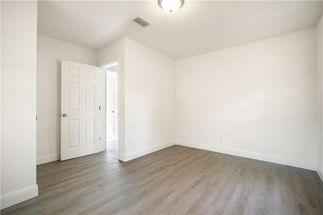 spare room featuring light hardwood / wood-style flooring