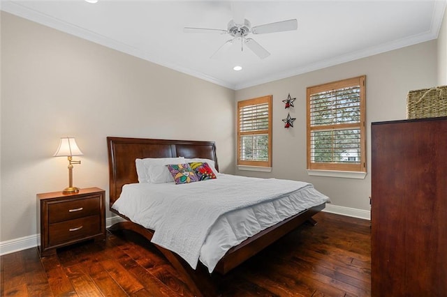 bedroom featuring dark wood-type flooring, ceiling fan, and ornamental molding