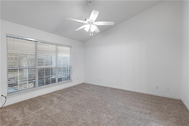 unfurnished room featuring vaulted ceiling, carpet, and ceiling fan