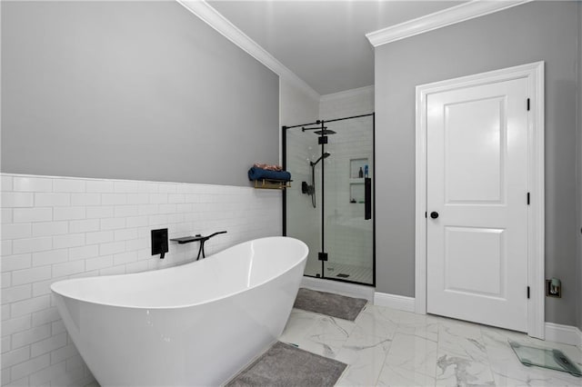 bathroom with tile walls, crown molding, and shower with separate bathtub