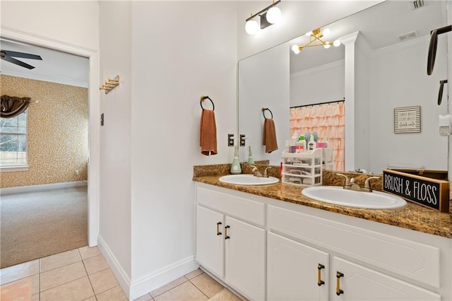 bathroom featuring tile patterned flooring, ornamental molding, vanity, and ceiling fan