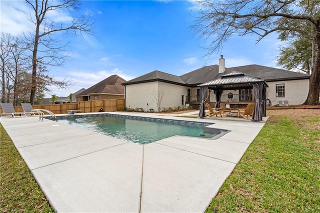 view of pool with a gazebo, a diving board, a patio, and a lawn