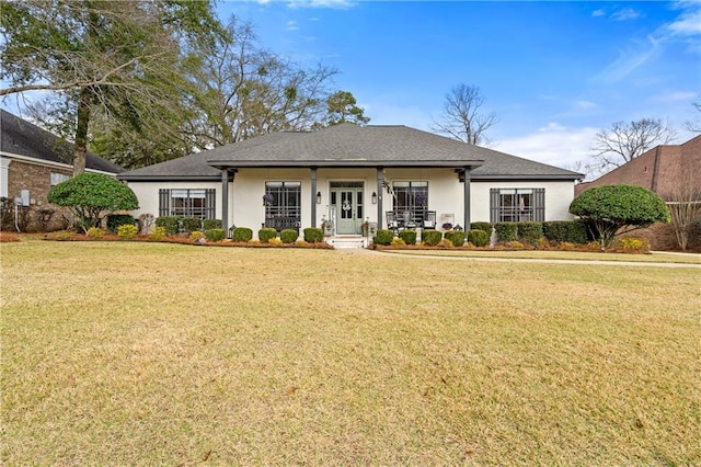 view of front of home with a front yard and a porch