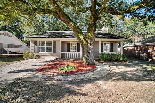 view of front of home with a porch and cooling unit