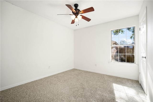 empty room featuring carpet and ceiling fan