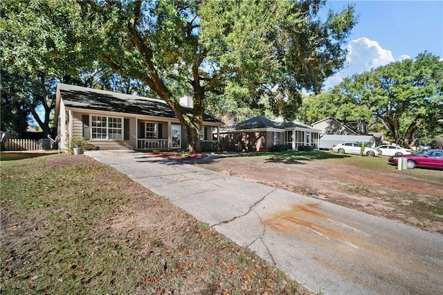 ranch-style home featuring a porch