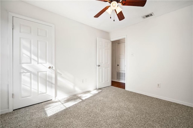 unfurnished bedroom featuring carpet flooring and ceiling fan