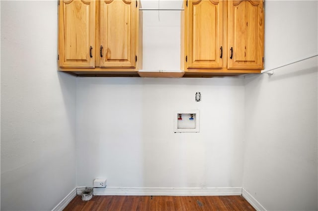 laundry room featuring cabinets, washer hookup, and dark hardwood / wood-style flooring