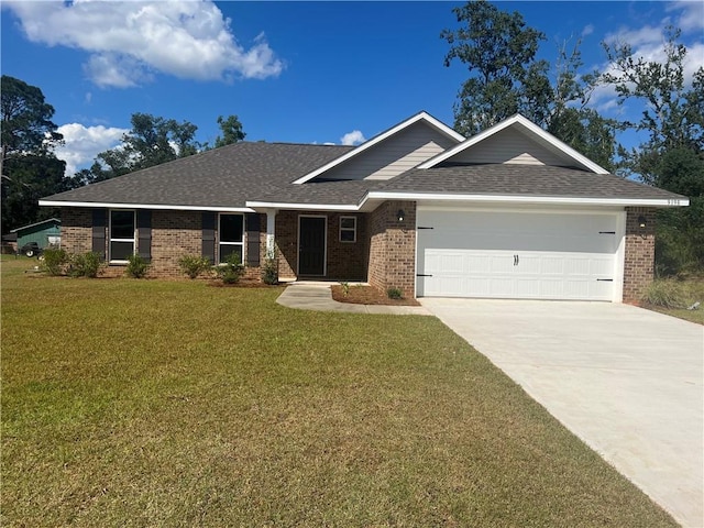 view of front of property with a front yard and a garage