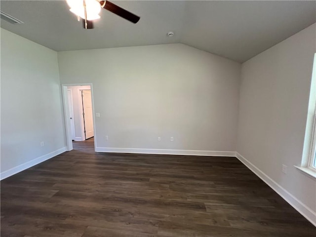 empty room featuring lofted ceiling, ceiling fan, and dark wood-type flooring