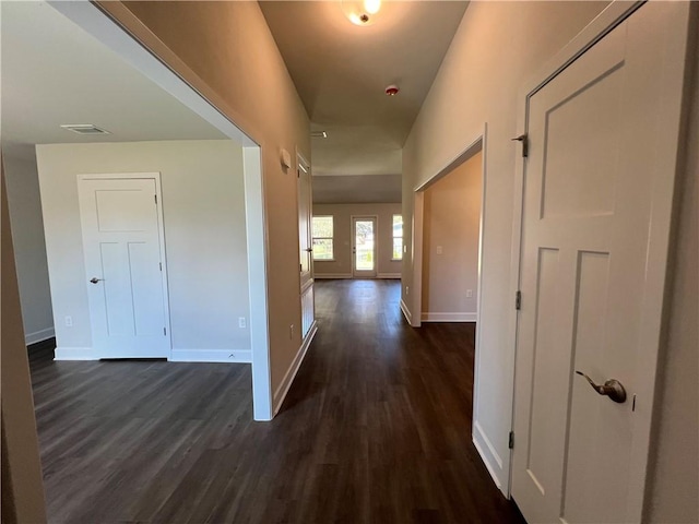 corridor with dark wood-type flooring