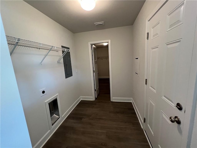 washroom with electric dryer hookup and dark wood-type flooring