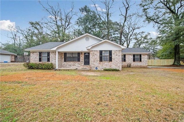 ranch-style house featuring a front lawn