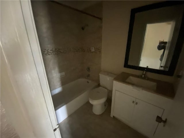 full bathroom featuring vanity, tiled shower / bath combo, and toilet