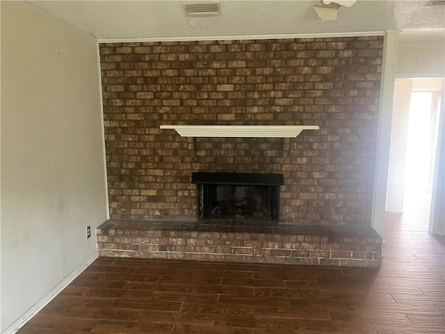 interior details with a fireplace and hardwood / wood-style flooring