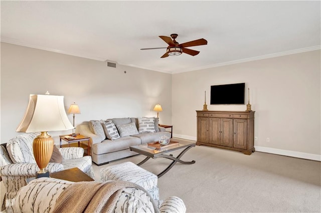 carpeted living room with ceiling fan and crown molding