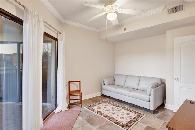 living room with ceiling fan and crown molding