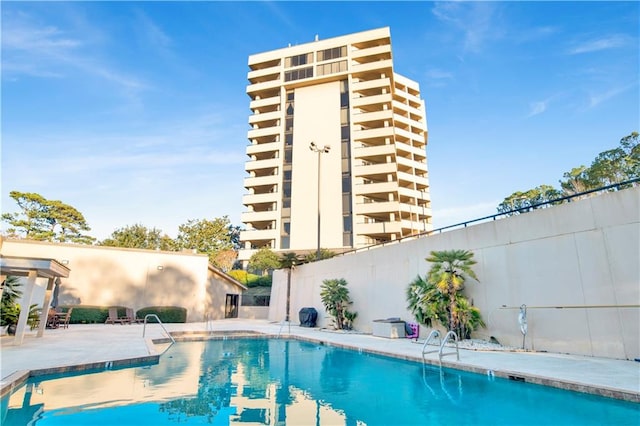 view of swimming pool with a patio