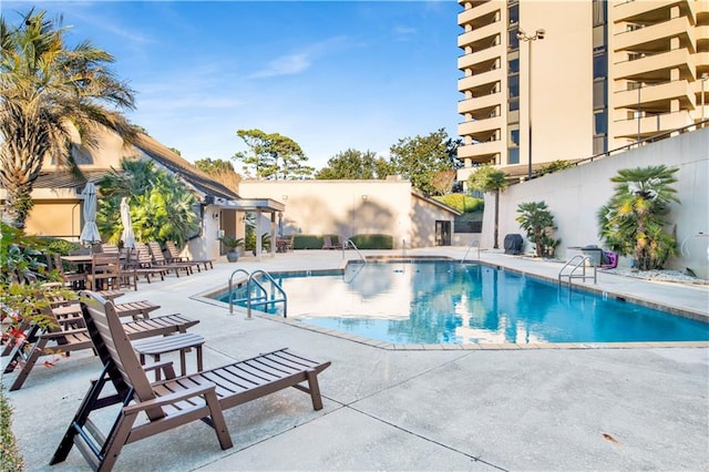 view of swimming pool with a patio area