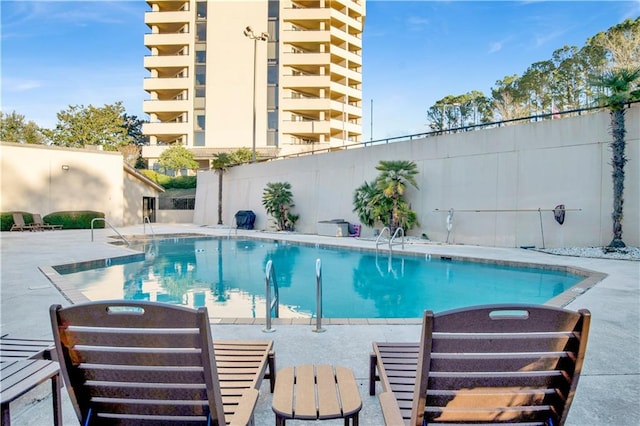 view of swimming pool featuring a patio