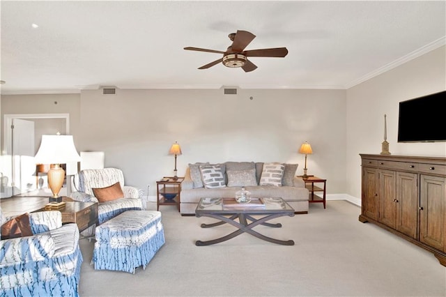 living room featuring ceiling fan, light carpet, and crown molding