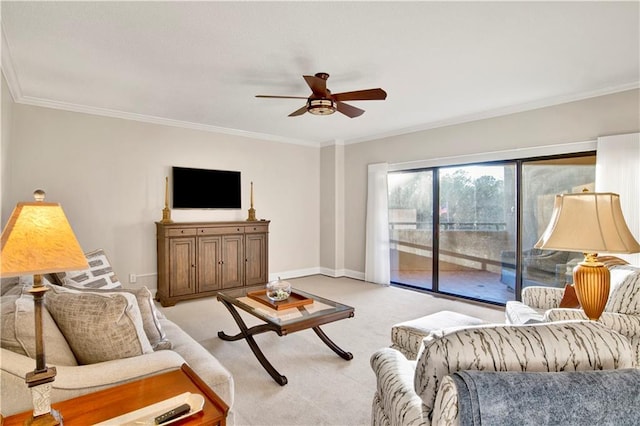 carpeted living room with crown molding and ceiling fan