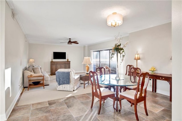 dining room featuring crown molding and ceiling fan