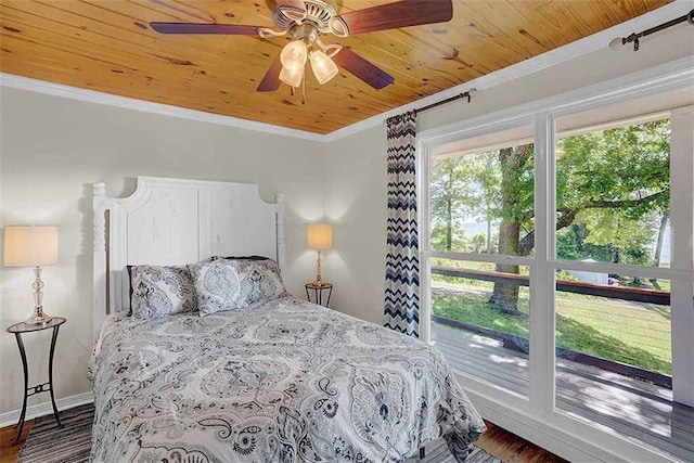 23749 Main St, Fairhope, AL 36532 - bedroom with wooden ceiling, crown molding, dark wood finished floors, baseboards, and ceiling fan