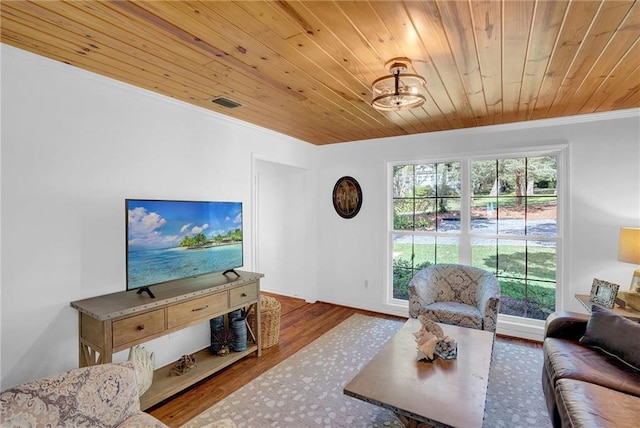 23749 Main St, Fairhope, AL 36532 - living room with ornamental molding, wooden ceiling, and wood finished floors