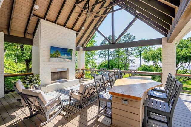 23749 Main St, Fairhope, AL 36532 - deck featuring an outdoor living space with a fireplace and outdoor dining area