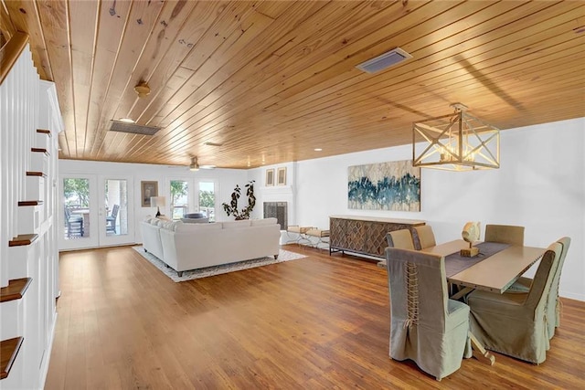 23749 Main St, Fairhope, AL 36532 - dining area with wooden ceiling, wood finished floors, and french doors