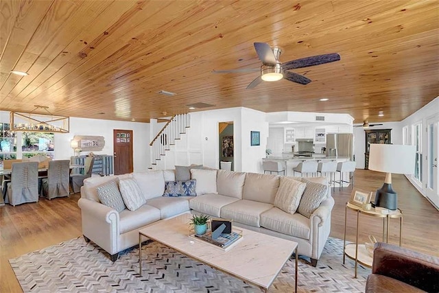 23749 Main St, Fairhope, AL 36532 - living area with wooden ceiling, ceiling fan, stairs, and light wood finished floors
