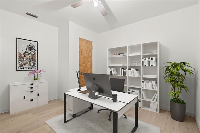 1208 Creekway Dr, Mobile, AL 36605 - home office with light wood-style flooring, a ceiling fan, and baseboards