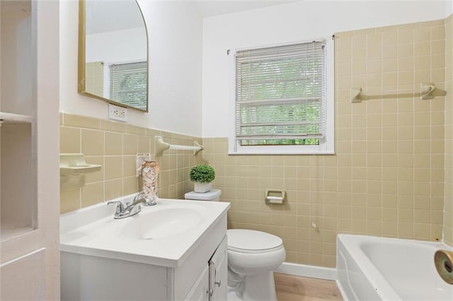 1208 Creekway Dr, Mobile, AL 36605 - bathroom featuring vanity, toilet, tile walls, and wood finished floors