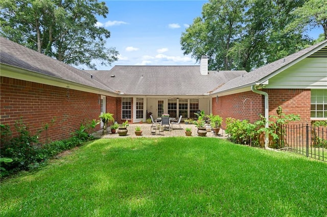 1525 Beacon Ct, Mobile, AL 36695 - rear view of house with brick siding, a patio, and a chimney
