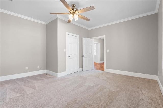 unfurnished bedroom with a closet, light colored carpet, ceiling fan, and ornamental molding