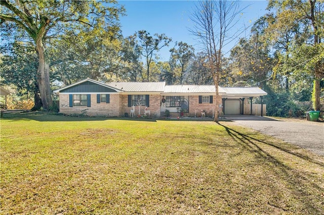 single story home with a garage, a front yard, and a carport