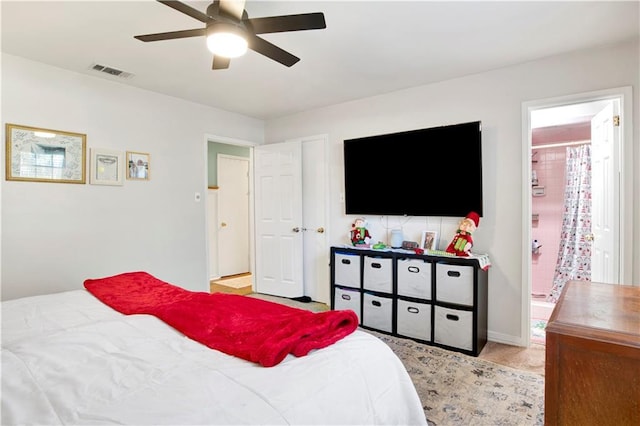 bedroom with connected bathroom and ceiling fan