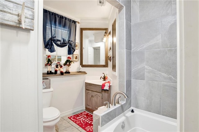 bathroom featuring a bath, tile patterned floors, toilet, vanity, and ornamental molding