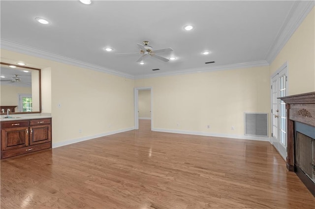 1140 Dominion Dr E, Mobile, AL 36695 - unfurnished living room featuring ceiling fan, light wood-style floors, a fireplace, ornamental molding, and recessed lighting