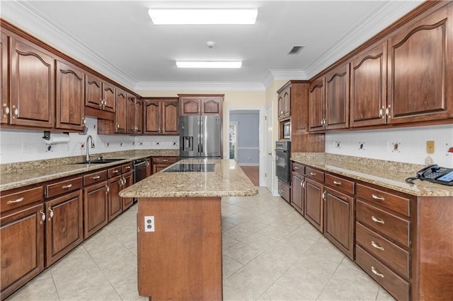 1140 Dominion Dr E, Mobile, AL 36695 - kitchen featuring stainless steel fridge, oven, crown molding, a kitchen island, and light stone counters
