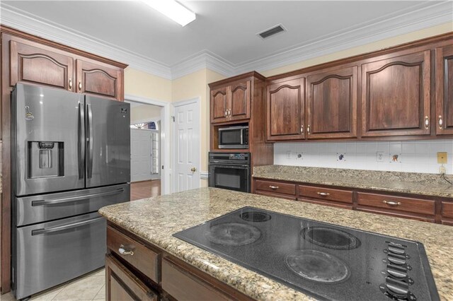 1140 Dominion Dr E, Mobile, AL 36695 - kitchen featuring black appliances, light stone counters, crown molding, and decorative backsplash