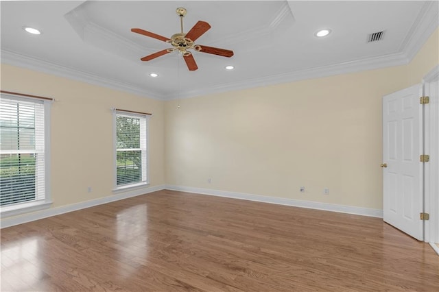 1140 Dominion Dr E, Mobile, AL 36695 - spare room featuring light wood finished floors, ornamental molding, a ceiling fan, a tray ceiling, and recessed lighting